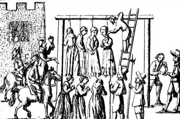 An image of suspected witches being hanged in England.