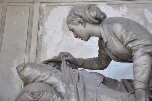A woman peers below a shroud covering a deceased loved one. Staglieno Cemetery:, 1881