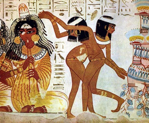 Ancient Egyptian women wearing kohl, from a tomb mural in Thebes (1420–1375 BC).