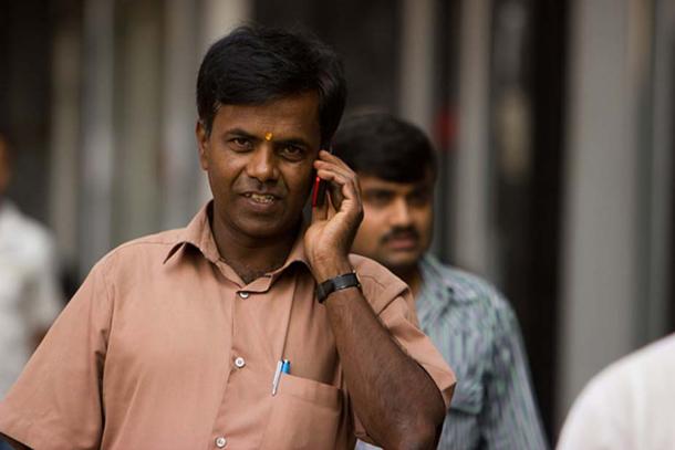 A man wearing a yellow bindi in Bangalore, India.