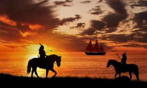 Native Americans see the arrival of an explorer’s ship. Credit: ginettigino / Adobe Stock