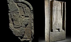 The broken top and bottom sections of the Assyrian stele.