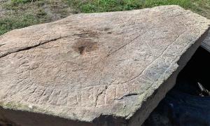 The Viking runestone was discovered by a farmer in southern Sweden when plowing his field. 	Source: Ingemar Lundgren / Västervik Museum