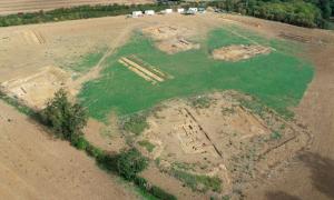 The 2022 excavations from the air, illustrating the scale and variety of the trenches examined, to enable a broader understanding of the villa complex. Source: © Historic England
