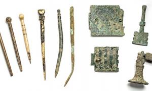 Scholarly tools from left: quills, styluses and book clasps.
