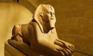 An Egyptian sphinx with a human head 