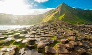 Visiting mythical places, like the Giant’s Causeway in Northern Ireland pictured, helps us connect with our past, as well as nature. Source: drimafilm / Adobe Stock 
