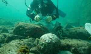The underwater archaeologists found dozens of cannonballs at the wreck site.