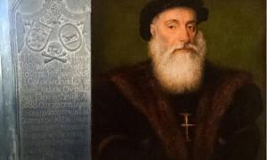 Engraved plaque near the explorer’s tomb in Kochi, India and portrait of Vasco da Gama.