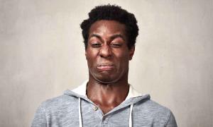 A man contorting his face at the idea of some of the weirdest foods in history. Source: Kurhan / Adobe Stock