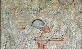 Pharaoh Akhenaten in the center and his family worshiping Aten personified as the rays of a solar disk; later such imagery was prohibited.		Source: Egyptian Museum / Public domain