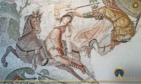A hippeis rider seizes a mounted Amazonian warrior armed with a labrys by her Phrygian cap. Roman mosaic Daphne, Antioch-on-the-Orontes (now Antakya in Turkey), (fourth century AD)/ Louvre, Paris. (Jacques MOSSOT/ CC BY-SA 4.0)