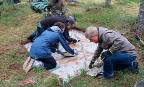 Archaeologists excavating at the site in Tainiaro forest, Finland.	Source: Aki Hakonen/Antiquity Publications Ltd