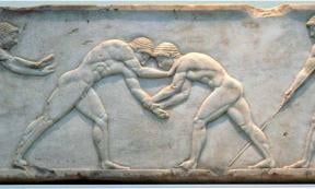 Ancient bas-relief on grave stele in Kerameikos in Athens, Greece depicting two wrestlers in action.	Source: National Archaeological Museum of Athens/ CC BY-SA 2.0 DE