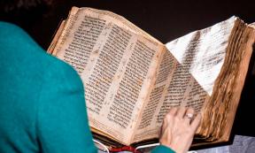 Sharon Mintz of Sotherby’s with the Codex Sassoon, oldest Hebrew Bible. Source: Courtesy of Sotheby’s