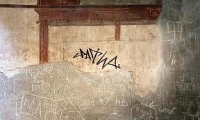 Tourist Defaces Roman Wall in Herculaneum