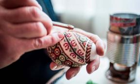 Lady making traditional decorated eggs in the Bukovina Region of Romania. Source: Matthew / Adobe Stock. 