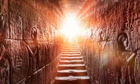 Egypt’s Edfu temple with its passage lined by two glowing walls full of Egyptian hieroglyphs. Source: Konstantin/Adobe Stock	