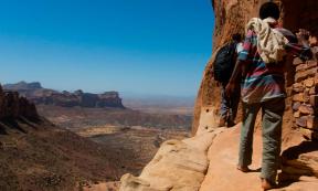 Towards the rock-hewn church of Abuna Yemata Guh in Tigray Ethiopia. Source: Reto Ammann / Adobe Stock.