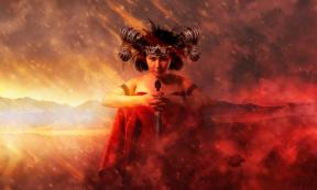 Gothic queen in red dress doing magic