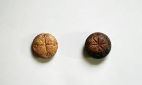 The two carved fifth century game pieces recovered during recent excavations at Hadrianopolis, Turkey.