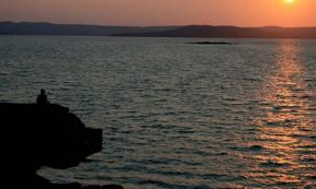 Sunset looking across Port Warrender to the Mitchell Plateau on the Kimberley coast. It is in Wunambal Gaambera country