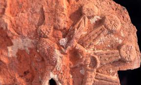 A fragment of the stone stele from the Ishtar temple. It depicts the goddess Ishtar inside a starburst with rosettes. Source: Penn Museum