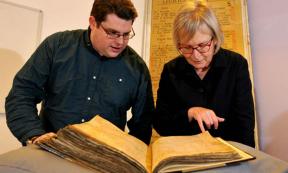 Gary Brannan and Sarah Rees Jones examine the note regarding Joan of Leeds in one of the archbishops’ registers. 