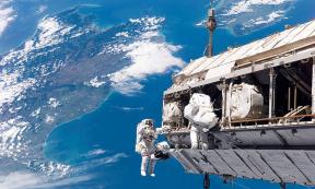 View from the International Space Station, looking down at a blue and fertile Earth where life has blossomed.