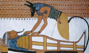 Anubis Reconstructing Osiris (1350 BC, Tomb of Ramses 1, Egypt).
