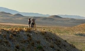 The researchers studying the mounds near the citadel of Gordion, Turkey.