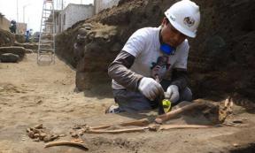 Excavating one of the Pre-Inca tombs.
