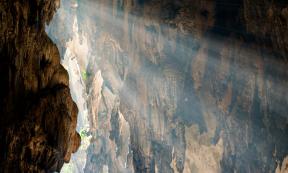 Ray of sunlight entering a rock chamber, representational. Source: Lina / Adobe Stock.