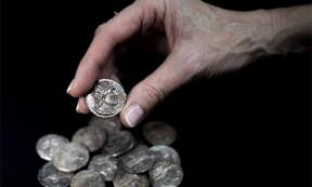 The hoard of fifteen tetradrachm were found in a wooden container lined with sheepskin and cloth (Israel Antiquities Authority)