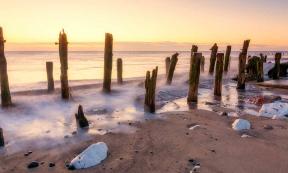 Spurn Point beach in East Yorkshire at Sunrise, where remnants of the medieval port town known as Ravenser Odd are believed to reside under the sea. Source: Tim Hill / Adobe Stock