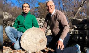 (Left to Right), archaeologist Federico Bernardini and astronomer Paolo Molaro at Castelliere di Rupinpiccolo, holding what could be the oldest celestial map ever discovered. Source: INAF