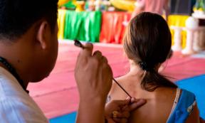 Thai Tattoo Master makes Sak Yant tattoo. Source: Denis / Adobe Stock.