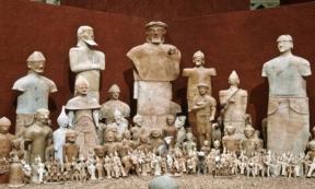 Photograph from one of the Cyprus Exhibitions at Medelhavsmuseet with the terracotta sculptures and the betyl (stone) from Agia Eirini.	