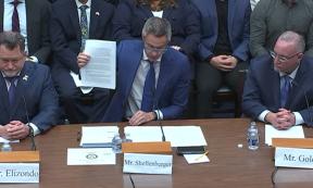 Mr Shellenberger holds up the whistleblower report at the UAP Congressional Hearing.