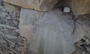 Letters and shapes crudely scratched into prehistoric grinding slicks on the Petroglyph Point Trail, permanently damaging these artifacts.