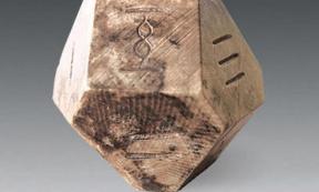A fourteen-sided die may have been used to play the ancient game of “bo”.