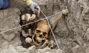 An archaeologist working in one of the tombs found at the Huaca Pucllana archaeological site in Lima, Peru. 