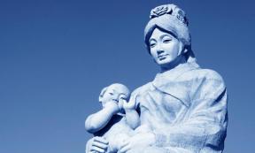 Traditional Chinese style sculpture depicting a mother and baby. New research on baby teeth suggests gender inequality was present from infancy. Source: junrong /Adobe Stock