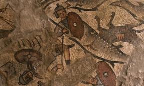 A big fish swallows an ancient Egyptian soldier on one of the mosaics found on the floor of the synagogue.