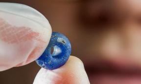 A blue glass bead at least 1,500 years old is among the finds archaeologists have made at the Ørland Main Air Station dig. 