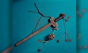 Coin sword made of an iron rod with Chinese cash coins of the 19th century tied to it with red and green string in the shape of a sword, with hanging ornaments. Source: British Museum / CC BY NC SA 4.0