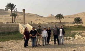 The research team stands in front of the pyramid of Unas’s Valley Temple, which acted as a river harbor in antiquity. Source: Eman Ghoneim/Nature