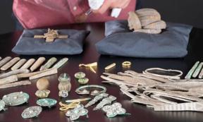 Senior Curator at National Museums Scotland, Martin Goldberg, looking at objects from the Viking age Galloway Hoard.