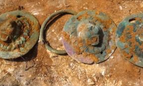 Three of the discs that were found inside the one Roman grave at Khirbat Ibreika.