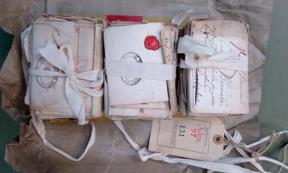 Three stacks of French love letters bound together by a ribbon, were finally opened by Cambridge University professor Renaud Morieux at the national archives, Kew. Source: The National Archives / Renaud Morieux